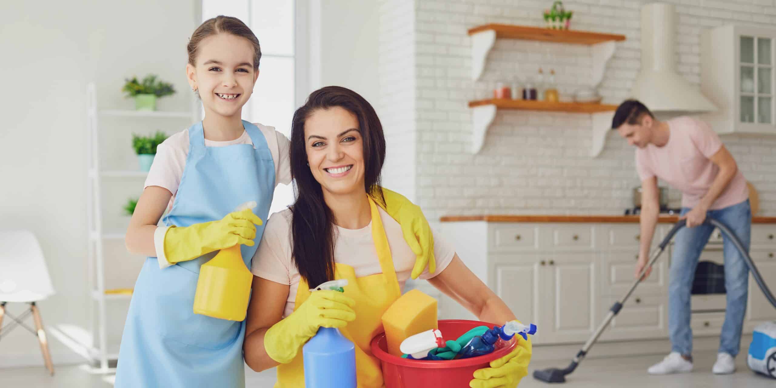 A family happily cleaning their house